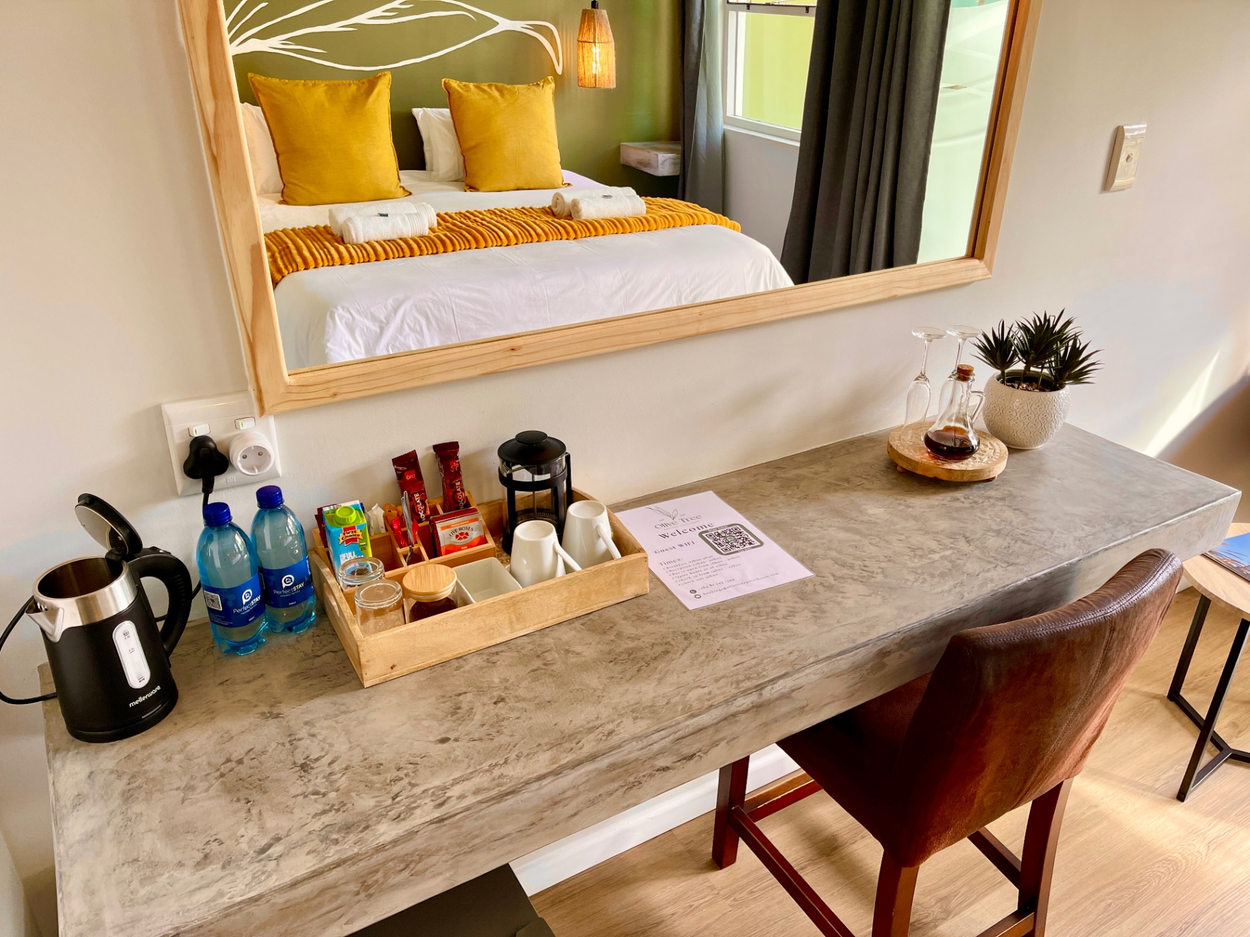 Desk detail with welcome card and amenities