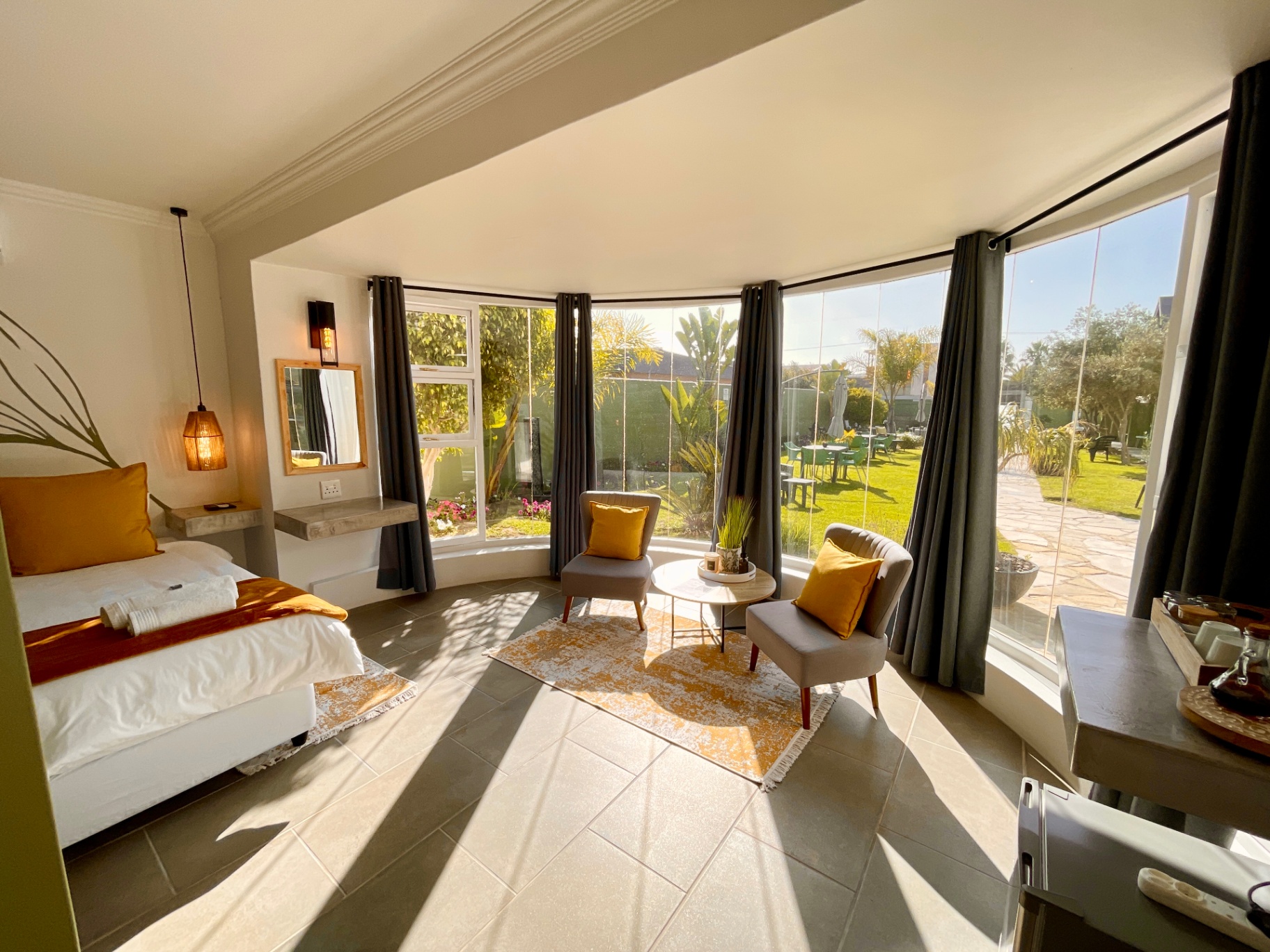 Spacious bedroom and sun-filled sitting nook